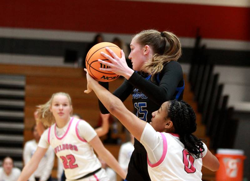 St. Charles North’s Bronwyn How grabs a pass during a game against Batavia on Monday, Dec. 16, 2024 in Batavia.
