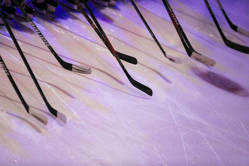 FILE - Ferris State players hold hockey sticks prior to an NCAA hockey game against the Miami RedHawks, on Oct. 18, 2019, in Oxford, Ohio. Before arriving at Miami University in Ohio, as director of hockey operations, Brad Aldrich had been allowed to resign from the Blackhawks over accusations of sexually assaulting a player. A November 2012 sexual assault allegation against Aldrich at Miami led to his resignation. (AP Photo/Aaron Doster, File)