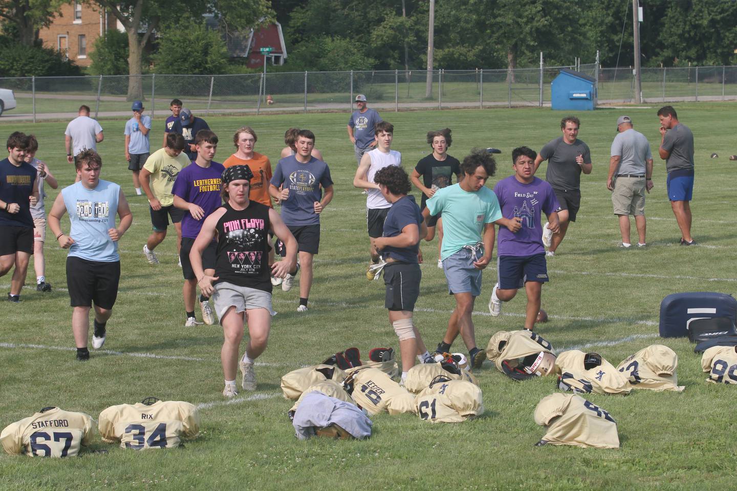 Members of the Marquette football team practice during football camp on Monday, July 24, 2023 on the practice field next to Gould Stadium in Ottawa.