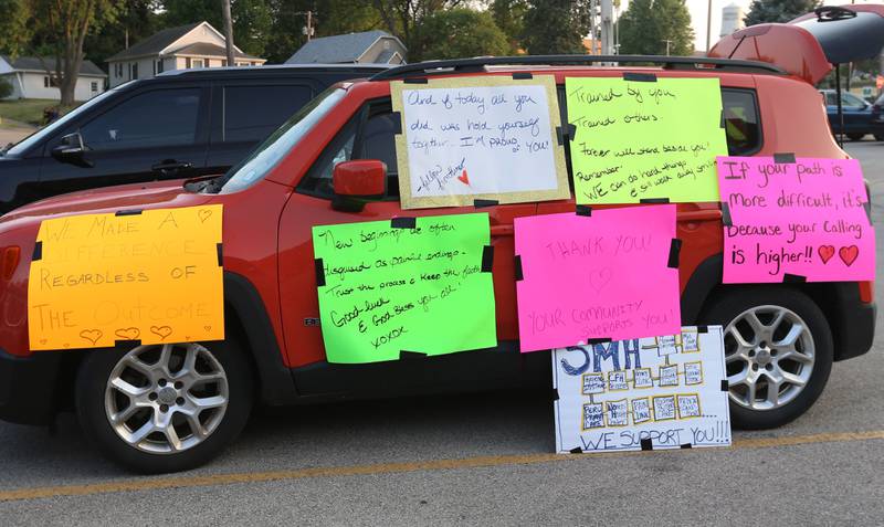 A vehicle full of positive signs is parked in the parking lot of St. Margarets's Hospital during a gathering on Friday, June 16, 2023 in Spring Valley.