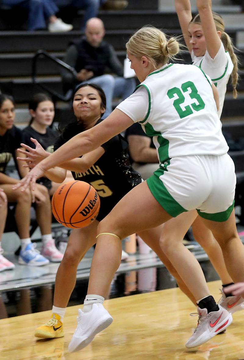 Crystal Lake South's Laken LePage steals the ball from Grayslake North's Mia Leilani Gumapas (left) as Crystal Lake South's Makena Cleary (right) helps defend on the play during a Northern Illinois Holiday Classic semifinal girl basketball game on Tuesday, Dec. 16, 2025, at McHenry High School.