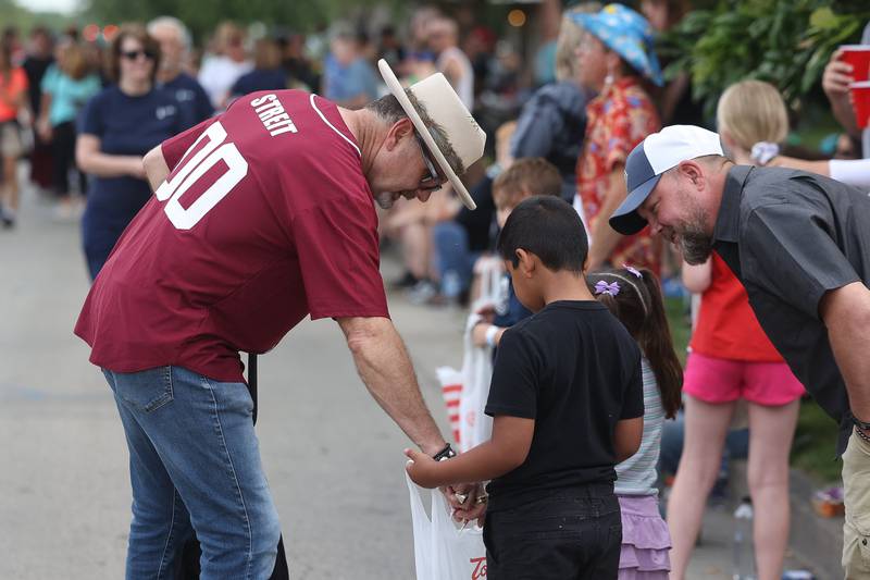 Lockport Mayor Steven Streit hands out candy in the Old Canal Days Parade on Friday June 7, 2024 in Lockport.