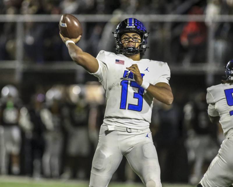 Lincoln-Way East's Jonas Williams (13) floats a pass for a touchdown during Class 8A quarterfinal football game between Lincoln-Way East at Mount Carmel. Saturday, Nov 15, 2025 in Chicago.