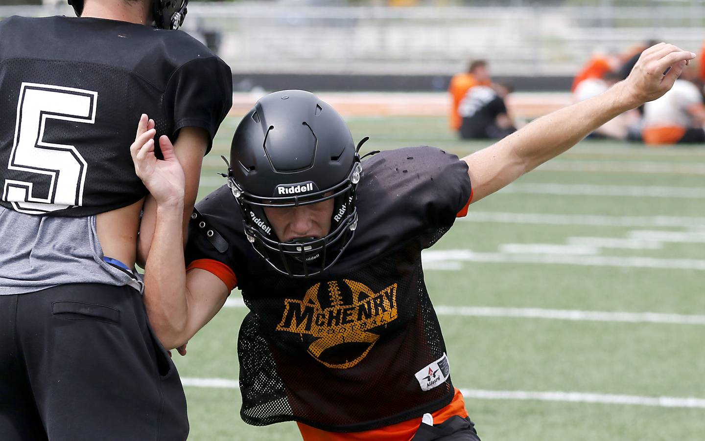 McHenry’s James Butler runs throw a defensive drill during football practice on Thursday, July 24, 2025, at McCracken Field, in McHenry.