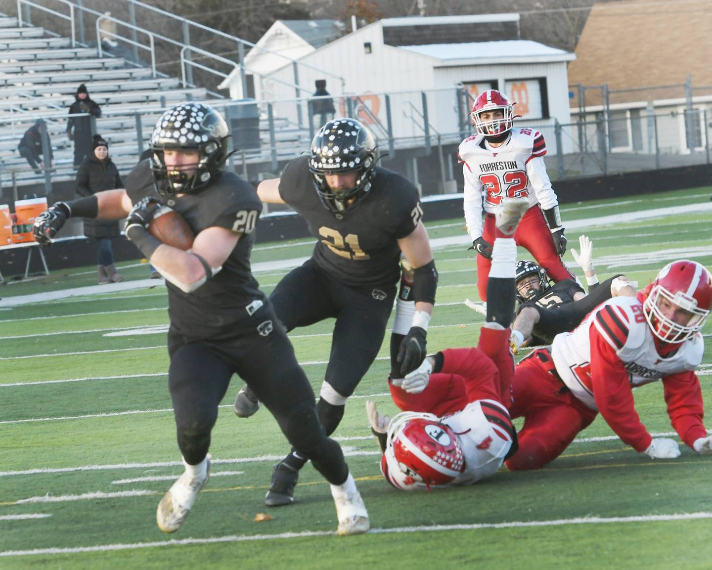 Lena-Winslow's Gunar Lobdel heads to the end zone after avoiding Forreston' defenders at the 1A semifinal against Forreston at Freeport High School on Saturday, Nov. 19. The Panthers ended the Cardinals season willing the game 38-16 to advance to the state championship game next Friday in Champaign.