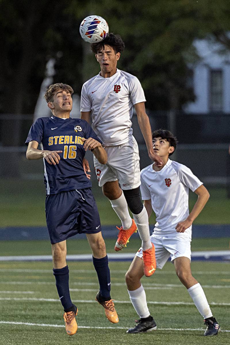 Sterling’s Jubraan Alkhalaf (left) and Lasalle-Peru’s Rylee Hernandez work for the ball Tuesday, Oct. 17, 2023 in a regional semifinal in Sterling.