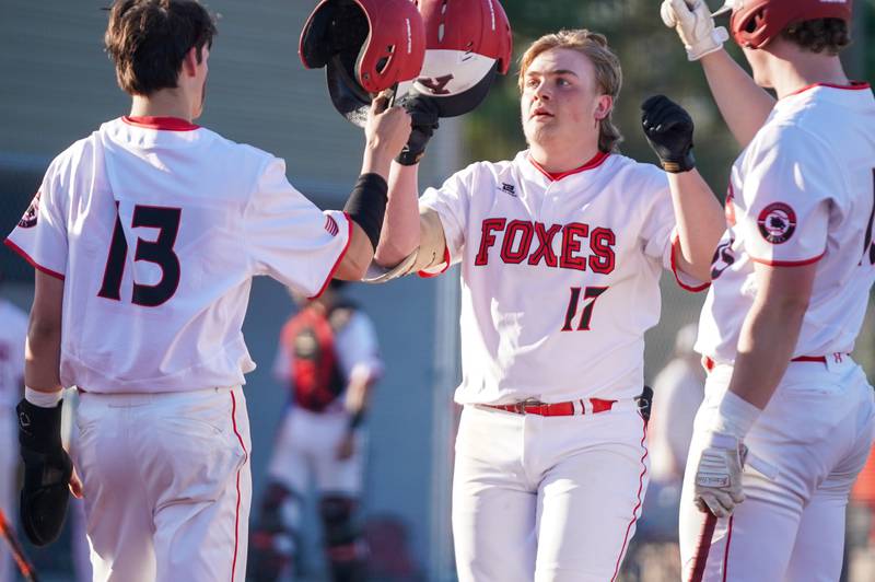 Yorkville's Kameron Yearsley (17) is greeted at home after hitting a three run homer against West Aurora during a baseball game at Yorkville High School on Monday, April 15, 2024.