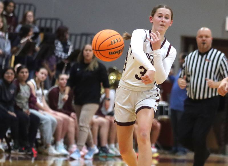 Marengo’s Maggie Hanson passes the ball against Woodstock North in varsity girls basketball on Tuesday, Dec. 2, 2025, at Marengo High School in Marengo.