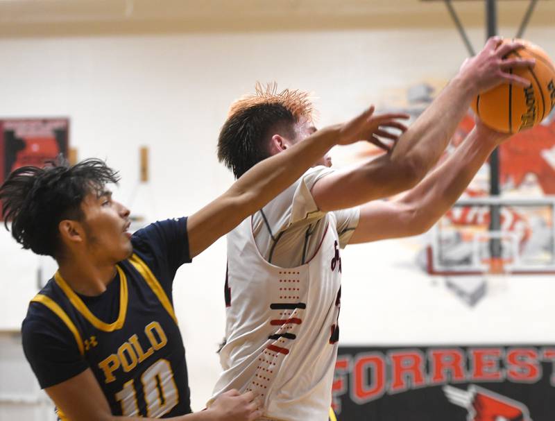 Polo's Esteban Salinas (10) and Forreston's Brennan Byers (31) battle for a rebound on Saturday, Dec. 13, 2025 at the 64th Annual Forreston Holiday Basketball Tournament held at Forreston High School.
