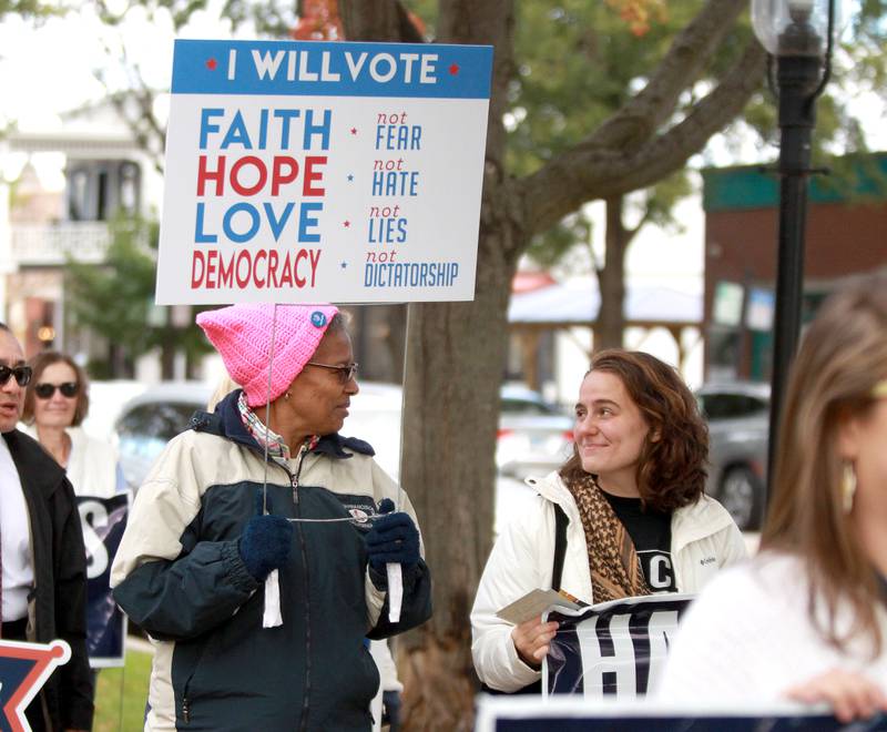 Dorothy Johnson-Linnér (left) and Faith Powell (right) participate in the Roe the Vote and March to the Polls from the Kane County Courthouse to the Kane County Clerk’s office in Geneva on Tuesday, Oct. 15, 2024.