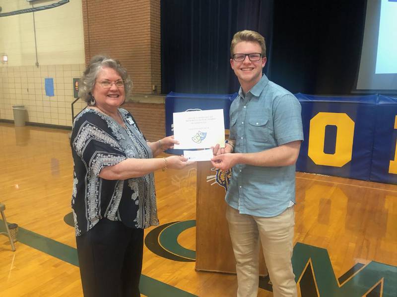 Kathie Hart, an Indian Valley Theatre Mimi Bryan Scholarship Committee member, presents Payton Penman with the scholarship award at the Somonauk High School Senior Awards Night.