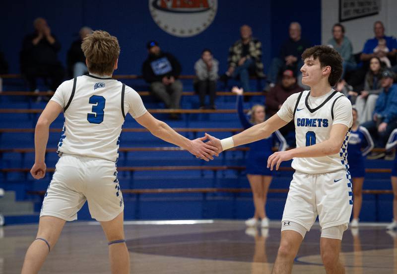 Clifton Central's Derek Meier, right, gives a five to teammate Andrew Rohlwing, left, after he hit a three-pointer during a Class A Regional game againt Milford on Monday, Feb. 23, 2026.
