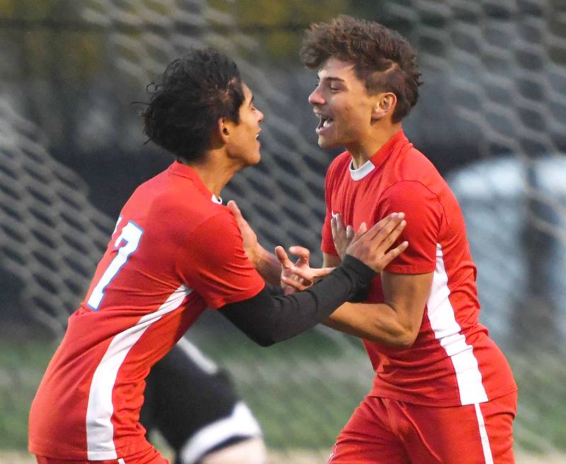 Oregon's Ivan Hernandez (5) celebrates with Irvin Acosta (17) after scoring a goal against North Boone at the 1A Byron Regional on Tuesday, Oct. 21, 2025.