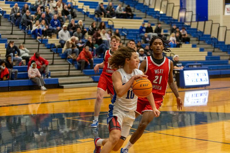 Geneva's Cody Rader comes up with the ball against West Aurora on Monday, Jan. 19,2026 in Geneva.