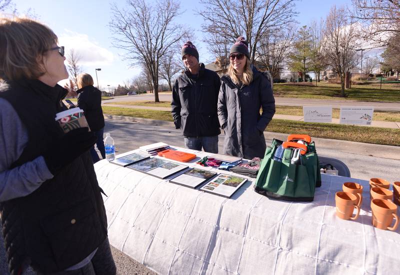 Trish Forstner-Cayia of Michigan talks with Homegrown Gardens builder Corbett McCormick of Chicago and owner  Karen Miller of Winfield during the Glen Ellyn Park District's Polar Market held at Maryknoll Park Saturday, Dec. 9, 2023.