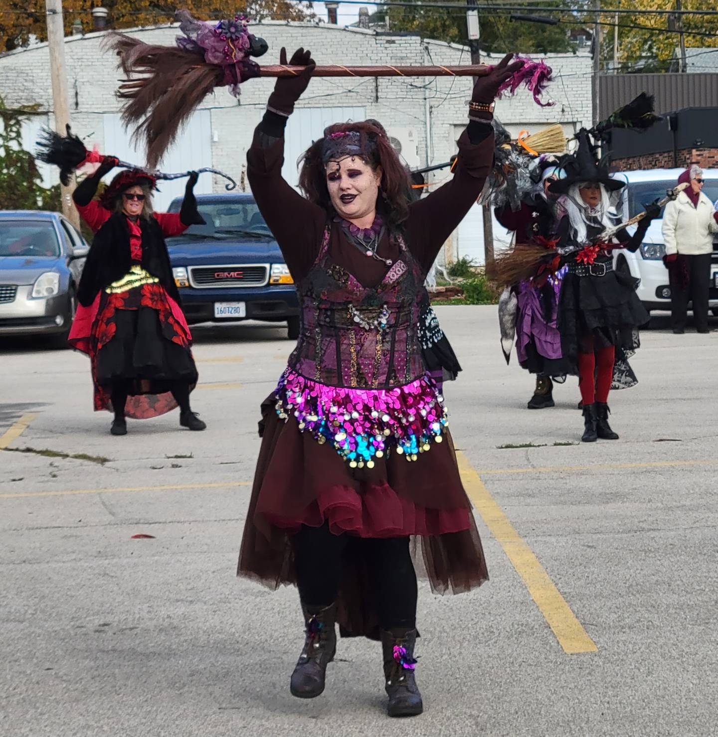 The Hocus Pocus Hags enjoy a dance moment at Saturday's La Salle Halloween Celebration.