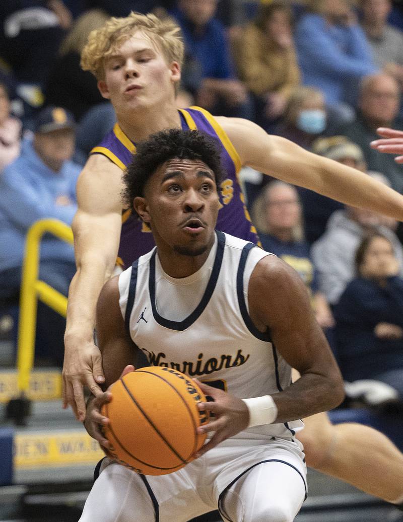 Sterling’s Kaedon Phillips works against Sherrard’s Carter Brown Monday, Dec. 16, 2024, at Sterling High School.