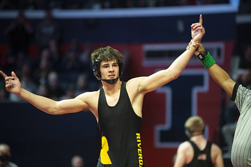 Riverdale's Collin Altensey celebrates his win during the 1A 152lb finals match at the IHSA state wrestling meet on Saturday, Feb. 19, 2022.