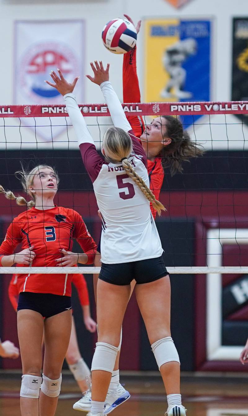 Oswego’s Sidney Hamaker (13) goes up for a kill against Plainfield North's Elizabeth Fitzgerald (5) during the class 4A Plainfield North regional volleyball final at Plainfield North High School on Thursday, Oct. 26, 2023.