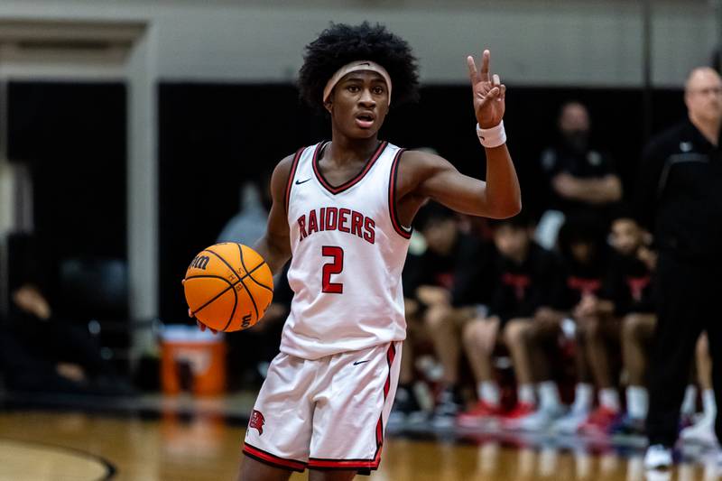 Bolingbrook's Mason Williams calls a play during a varsity boys basketball game against Oswego East at Bolingbrook on Dec. 12, 2025.