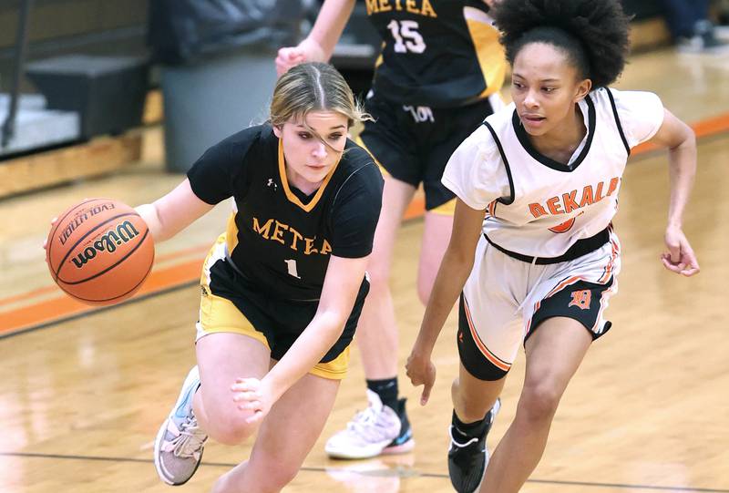 Metea Valley's Reese Valha pushes the ball up the court ahead of DeKalb's Madison McNeil during their game Thursday, Jan. 19, 2023, at DeKalb High School.