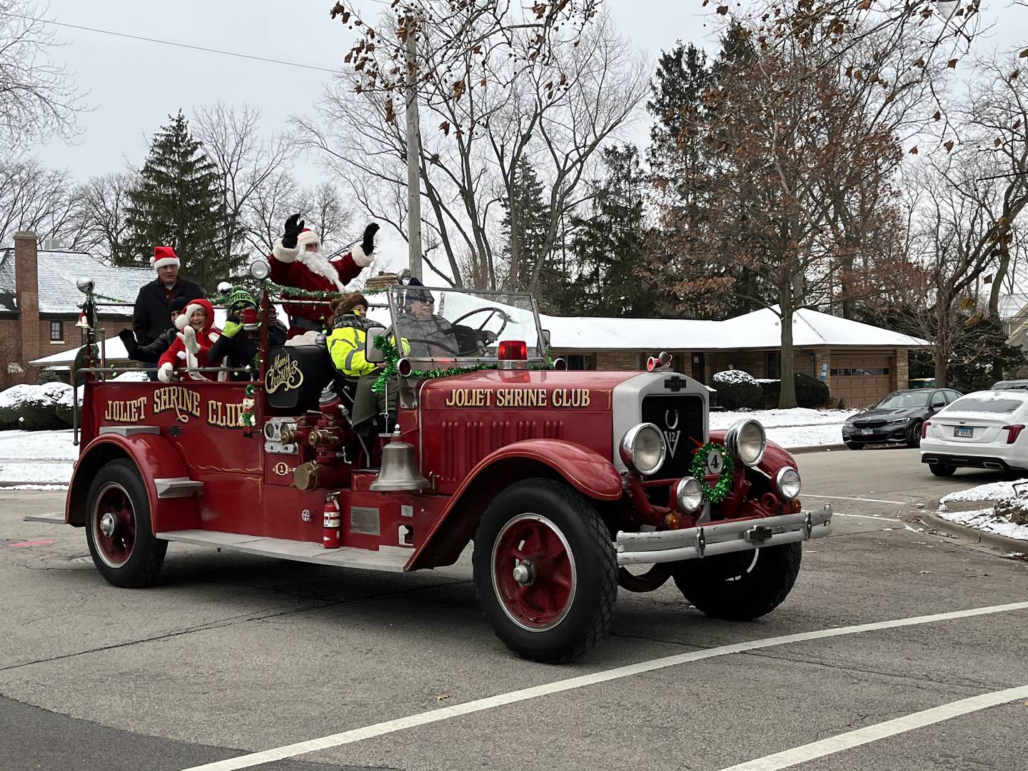Santa Claus, along with Joliet city officials, ride through Joliet on Saturday, Dec. 17, 2022, for the Santa Send-Off parade.