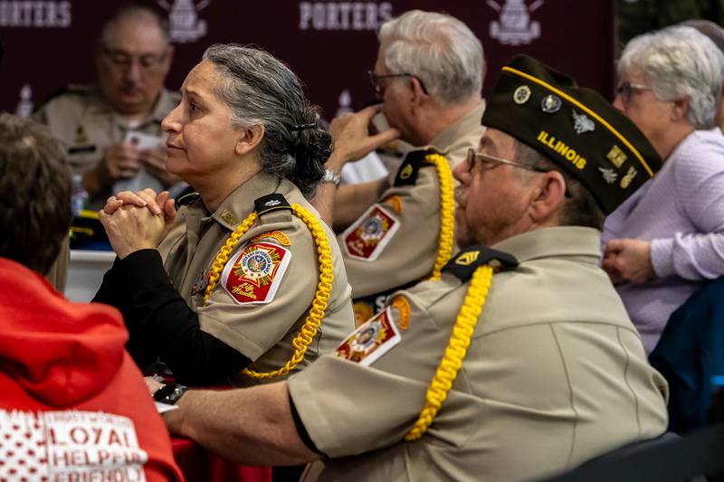 Elvira Dominguez and Tom Donovan, of Bremen Post 2791, listen to remarks during the dinner portion of Lockport Township High School’s 11th Annual Veteran Night Celebration on Jan. 23, 2026.
