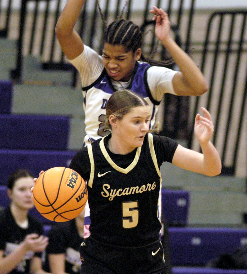 Dixon's Ahmyrie McGowan applies pressure to Sycamore's Grace Amptmann. The Dixon Duchesses beat the Sycamore Spartans 55-47 in a non-conference game played at Lancaster Gym in Dixon on Saturday, December 20th, 2025.