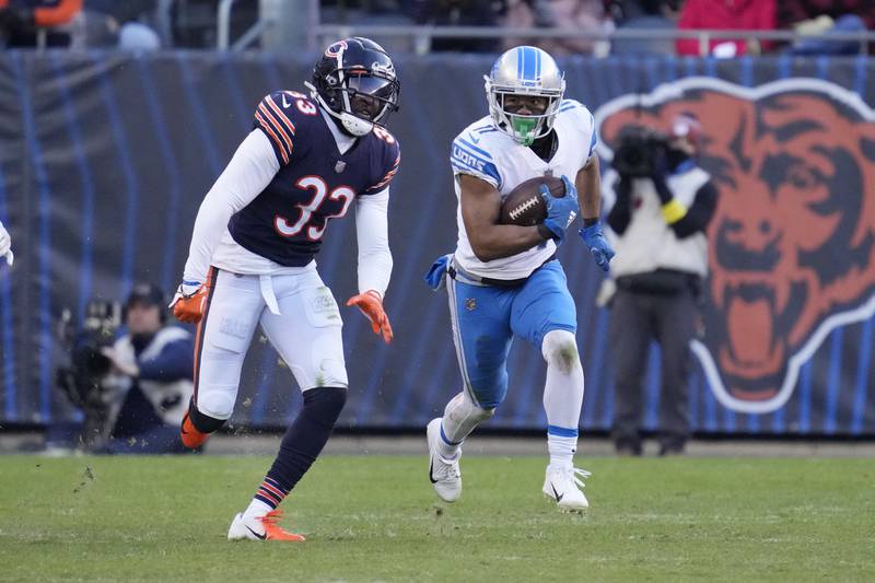 Detroit Lions wide receiver Kalif Raymond runs past Chicago Bears cornerback Jaylon Johnson during the second half Sunday in Chicago.