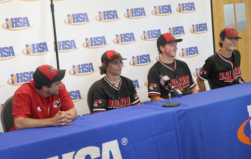 Henry-Senachwine head baseball coach Max Kirbach and players Mason Guarnieri, Mason Johnson and Carson Rowe smile while being interviewed in the media room after defeating Newman in the Class 1A State semifinal game on Friday, June 2, 2023 at Dozer Park in Peoria.
