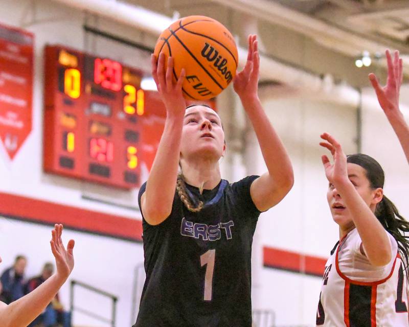 Oswego East's Aubrey Lamberti (1) makes a layup during the game on Thursday Dec. 18, 2025, while traveling to take on Yorkville High School.