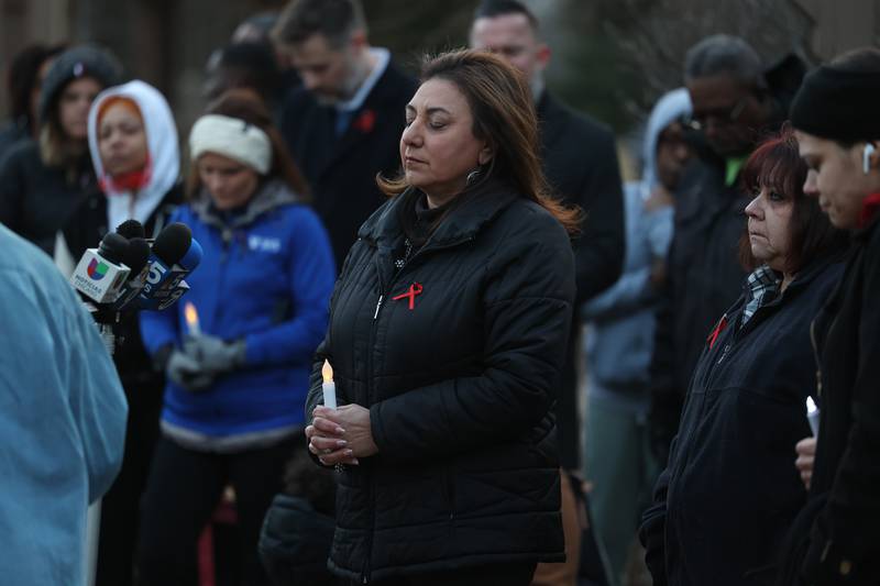 Bolingbrook Mayor Mary Alexander-Basta partakes in a moment of silence at the candlelight vigil for the victims of the March 5th shooting on Wednesday, March 8th, 2023 in Bolingbrook.