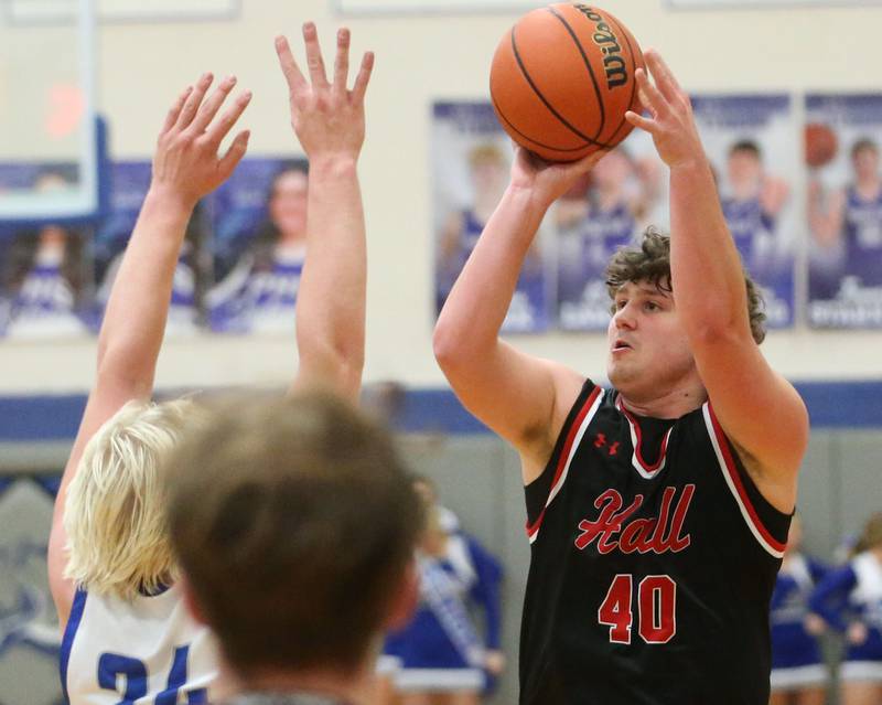 Hall's Payton Dye shoots a jump shot over Princeton's Daniel Sousa on Friday, Jan. 26, 2024 at Princeton High School.