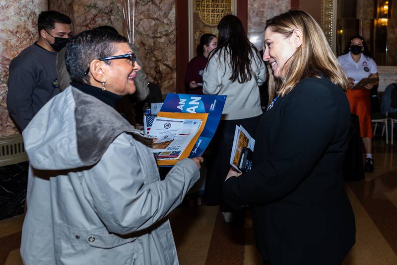 New U.S. citizen Carmen Sevilla chats with Illinois State Senator Rachel Ventura following the Naturalization Ceremony at Rialto Square Theatre in Joliet on April 17, 2025.