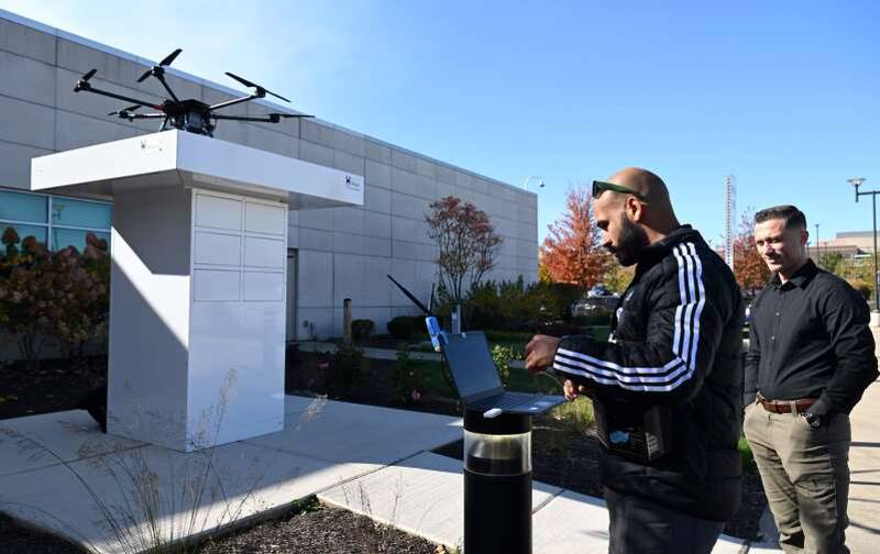 Pilot in command Allen Sanchez, left with Director of Operations Grayson Sneed, prepares a drone for take off at Northwestern Medicine Delnor Hospital in Geneva. Northwestern Medicine is teaming up with Lombard-based Valqari to test drone deliveries of specimens and medical supplies on the Delnor campus.
