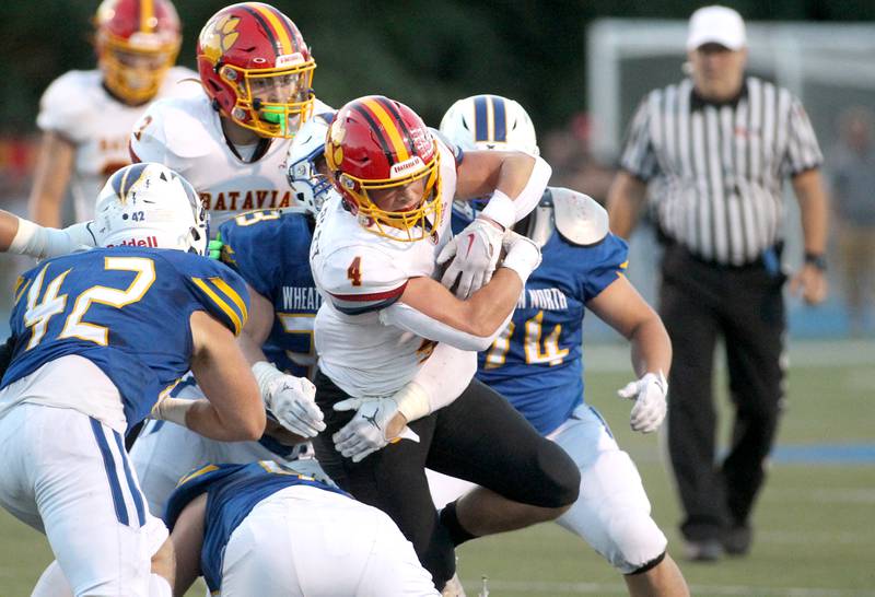 Batavia's Charlie Whelpley (4) carries the ball during a game at Wheaton North on Friday, Sept. 9, 2022.