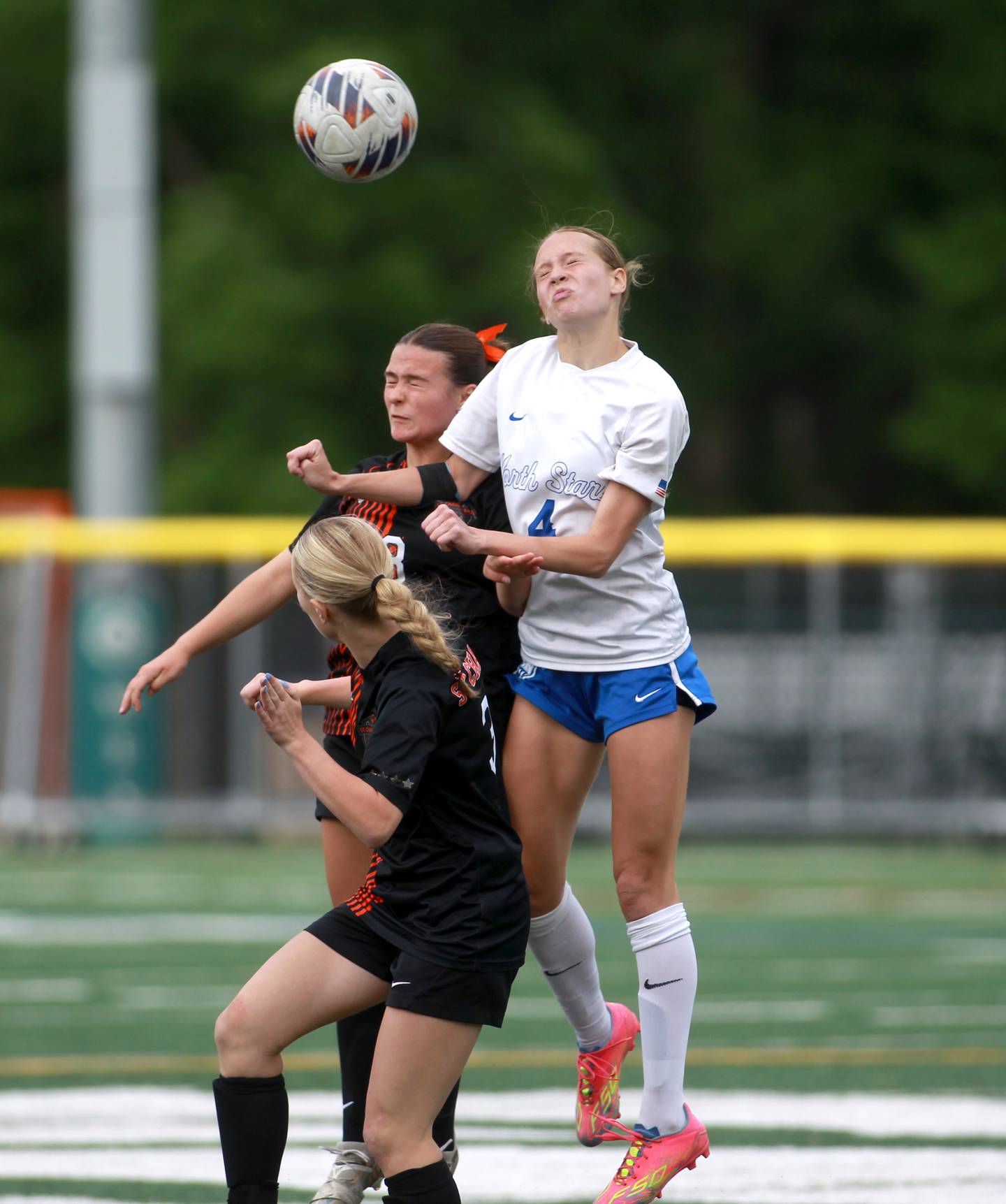 St. Charles East's Georgia Smith and St. Charles North's Kaitlyn Nudera head the ball during a Class 3A Glenbard West Sectional semifinal game on Tuesday, May 27, 2025 in Glen Ellyn.