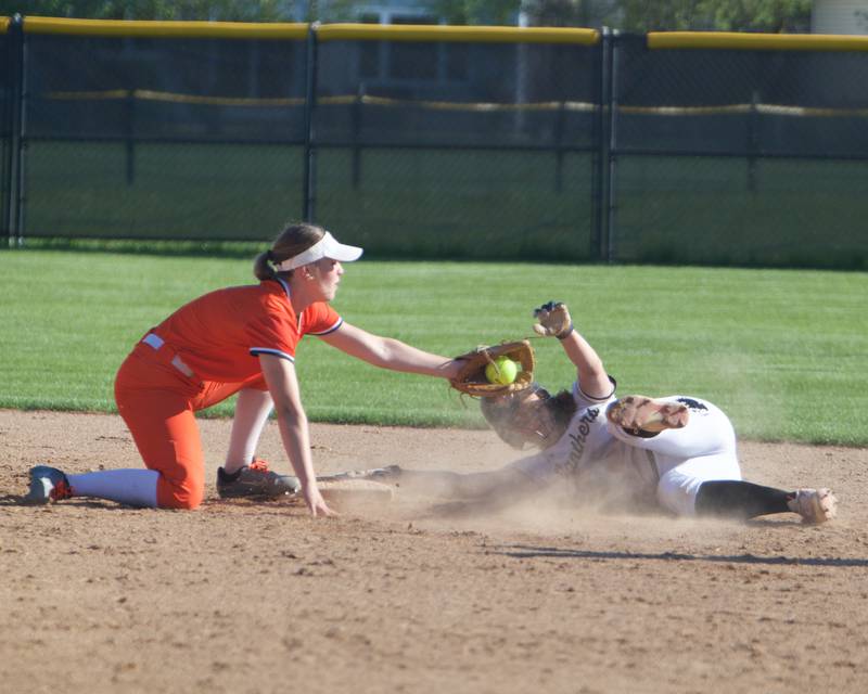 St. Charles East's Addison Wolf tags out Glenbard North's Tru Medina on Monday May 5, 2025 in Carol Stream.