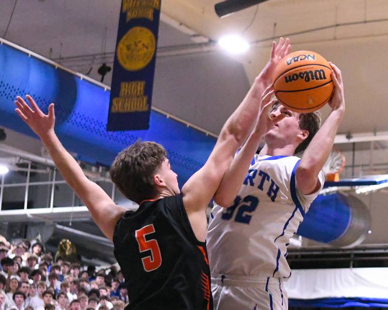 Wheaton North's Ben Gillmar (32) goes up for a shot and gets fouled by Wheaton Warrenville South's Reece Franks (5) during the game on Friday Feb. 6, 2026, held at Wheaton North High School.