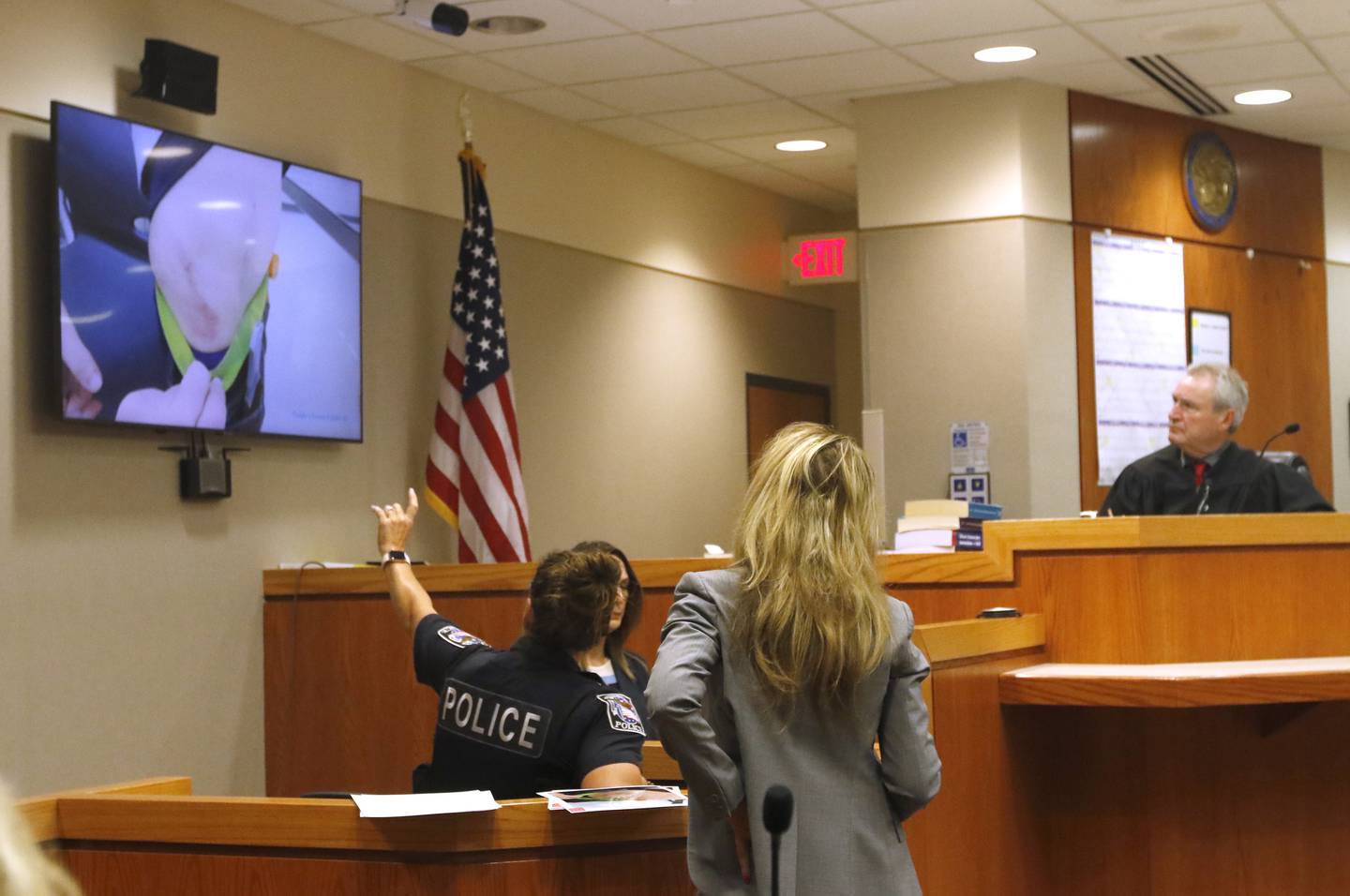 Crystal Lake Police officer Kimberley Shipbaugh testifies during the trial for the former Illinois Department of Children and Family Services employees Carlos Acosta and Andrew Polovin, before Lake County Judge George Strickland on Monday, Sept. 11, 2023, at the McHenry County courthouse. Acosta, 57, of Woodstock, and Polovin, 51, of Island Lake, each are charged with two counts of endangering the life of a child and health of a minor, Class 3 felonies, and one count of reckless conduct, a Class 4 felony, related to their handling of the AJ Freund case.