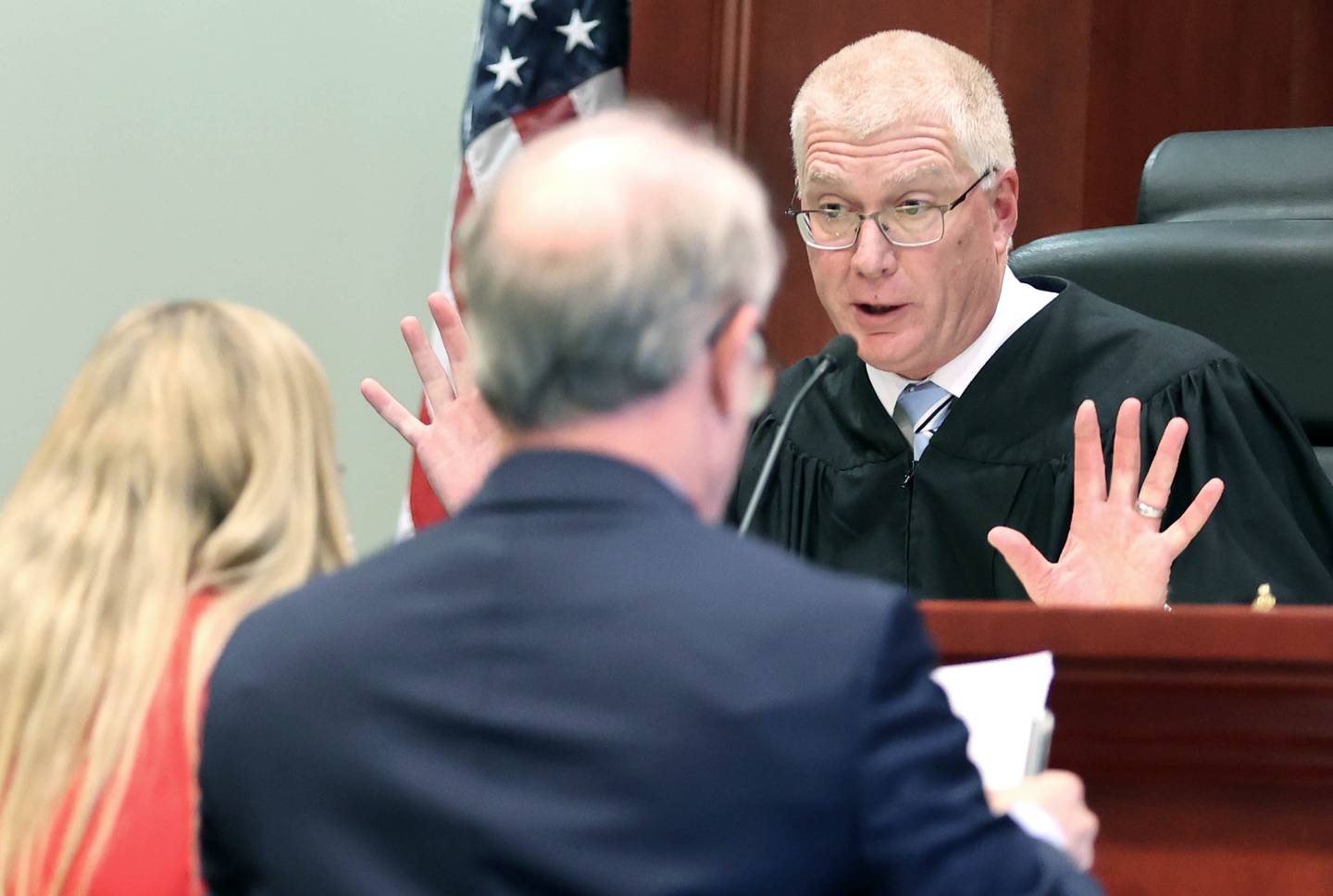 DeKalb County Judge Philip Montgomery meets with the defense and prosecuting attorneys Wednesday, Oct. 5, 2022, during the trial of former DeKalb School District 428 Superintendent Douglas Moeller. Moeller was charged in April 2018 with non-consensual dissemination of private sexual images, a class 4 felony.