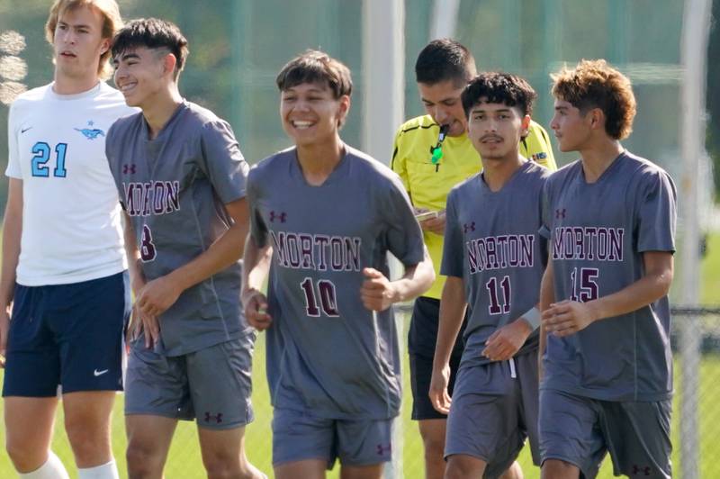 Morton’s Enrique Ayala (8) smiles after scoring his 4th goal of the game against Downers Grove South during a soccer match at Morton High School in Berwyn on Saturday, Oct. 5, 2024.