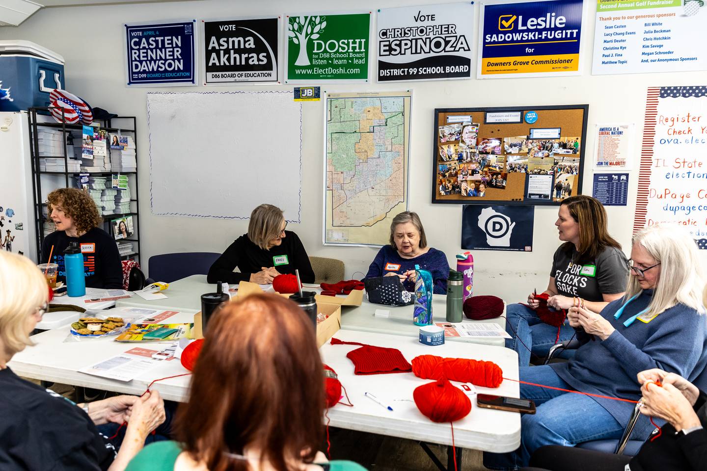 Attendees enjoy the ‘Melt the ICE’ Hat Knit-Along event at the Downers Grove Township Democrats Organization office on Feb. 15, 2026.