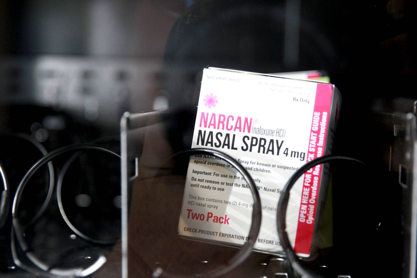 Daryl Pass, manager of Recovery Support Services for the Kenneth Young Center, fills the free narcan vending machine in the lobby of the Kane County Sheriff’s office in St. Charles. The center gets narcan free from the state overdose prevention program.