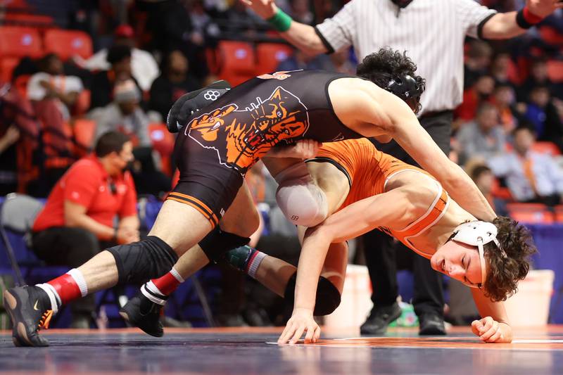 Dekalb’s Daniel Aranda (right) works away from Libertyville’s Caelan Riley in the Class 3A 120lb. 3rd place match at State Farm Center in Champaign. Saturday, Feb. 19, 2022, in Champaign.