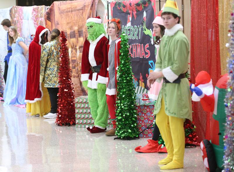 La Salle-Peru Township High School students dress in character as they meet children for the Santa's Workshop in the school cafeteria on Saturday, Dec. 7, 2024 at L-P High School.