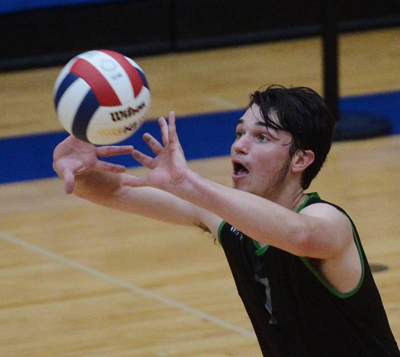 Glenbard West’s Adam Graham takes a Glenbrook South serve during the state quarterfinal match at Hoffman Estates High School Friday.