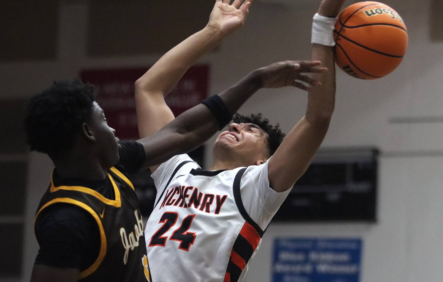 McHenry’s Adam Anwar, right, battles under the hoop against Jacobs’ Samson Averehi in varsity basketball on Wednesday, Dec. 4, 2024 at McHenry High School in McHenry.