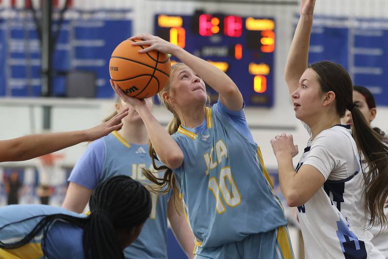 Joliet Catholic’s Emma Napier battles for a shot against Reavis in the Peotone Blue Devils Holiday Classic championship game on Monday, Dec. 29, 2025 in Peotone.