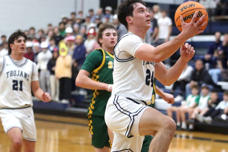 Cary-Grove’s Brady Bauer works under the hoop against Crystal Lake South in varsity boys basketball on Wednesday, Dec. 3, 2025, at Cary-Grove High School in Cary.